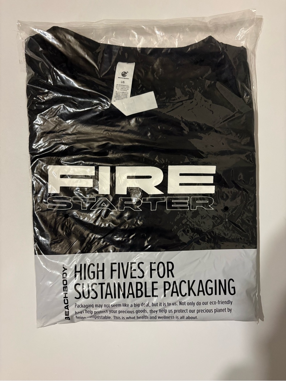 Fire Starter Beachbody Black Graphic Tee with White Tag Detail